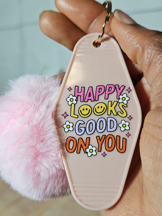 "Happy look good on you" Motel keychain